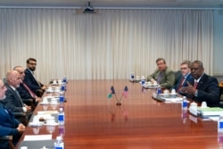 Abdullah Abdullah, who leads the High Council for National Reconciliation in Afghanistan, left, and Afghan President Ashraf Ghani meet with Secretary of Defense Lloyd Austin at the Pentagon in Washington, June 25, 2021.