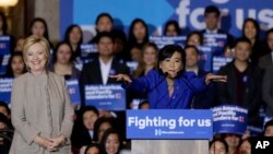 Democratic presidential candidate Hillary Clinton, left, is welcomed by Rep. Judy Chu, D-Calif., before addressing Asian American and Pacific Islander supporters in San Gabriel, Calif., Thursday, Jan. 7, 2016. 