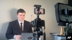 In this image made from video released by Leo Puglisi, 17-year-old Leo Puglisi records his online streaming news service 6 News Australia, from Melbourne, Australia, in January 2024.