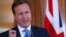 FILE - Britain's Prime Minister David Cameron (R) speaks during a press conference in London, July 17, 2013.