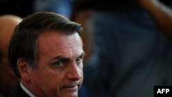 Brazil's President Jair Bolsonaro waits for the start of the Copa America football tournament final match against Peru at Maracana Stadium in Rio de Janeiro, Brazil, July 7, 2019. 