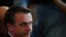 Brazil's President Jair Bolsonaro waits for the start of the Copa America football tournament final match against Peru at Maracana Stadium in Rio de Janeiro, Brazil, July 7, 2019. 