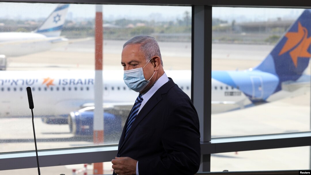 Israeli Prime Minister Benjamin Netanyahu prepares to give a statement at Ben Gurion International Airport, in Lod, near Tel Aviv, about preparations for direct flights, over Saudi Arabia, to the United Arab Emirates, August 17, 2020.