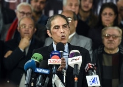 FILE - Egyptian journalist Khaled Dawoud speaks during a press conference in Cairo, Jan. 30, 2018.