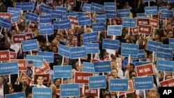 Delegates hold up signs during Maryland Gov. Martin O’Malley speech at the Democratic National Convention in Charlotte, N.C., on Tuesday, Sept. 4, 2012. 