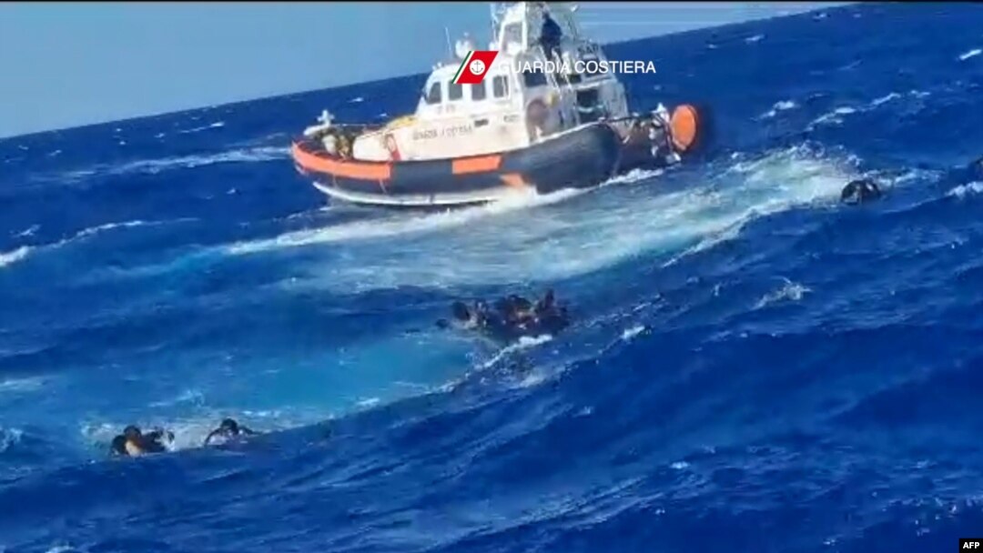 This photograph taken on August 5, 2023 by Italian Coastguard and released on August 6, 2023, shows a rescue operation that took place south of Lampedusa, consisting in rescuing 57 migrants, also recovering the lifeless bodies of a woman and a minor on board.