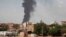Smoke rises over Khartoum, as fighting between the Sudanese Armed Forces and paramilitary Rapid Support Forces continues.