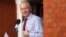 WikiLeaks founder Julian Assange makes a statement to the media and supporters at a window of Ecuadorian Embassy in central London, Aug. 19, 2012