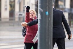 Protestors of an Iranian opposition group are sent away near the Grand Hotel Wien where closed-door nuclear talks with Iran take place in Vienna, Austria, April 6, 2021.