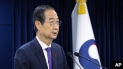 South Korean acting President Han Duck-soo speaks at the government complex in Seoul, South Korea, Dec. 26, 2024.