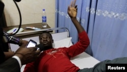 Kieve Sani, a survivor on the boat that capsized off the coast, speaks about his ordeal at the Bakor Medical Centre in Calabar, March 20, 2013. 