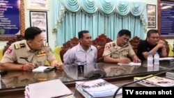 A screenshot of a video posted on Fresh News Facebook page shows Phal Penh, second from the left, the chief of an O’Rolear border post in Mondulkiri province, confessed to the shooting of the three environmentalists. (Screenshot from Fresh News Facebook page)