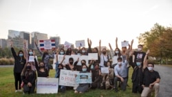 A group of Pro-democracy, Thai activists flash three-fingered salutes during a demonstration outside the Royal Thai Embassy, in Washington, DC. Tuesday, Oct. 20, 2020.