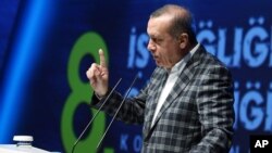 Turkey's President Recep Tayyip Erdogan speaks during a meeting in Istanbul, Turkey, May 8, 2016. "They have left us alone in our struggle" against Islamic State, he said pointing his finger at the West.