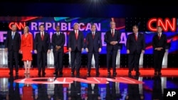 FILE - Republican presidential candidates take the stage during the CNN Republican presidential debate at the Venetian Hotel & Casino on Dec. 15, 2015, in Las Vegas. Candidates Carly Fiorina (2-L) and Rand Paul (R) have been cut from Thursday's debate due to low poll numbers.
