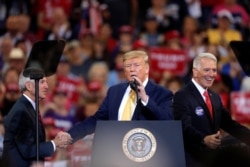 FILE - President Donald Trump speaks at campaign rally in Lake Charles, La., Oct. 11, 2019.