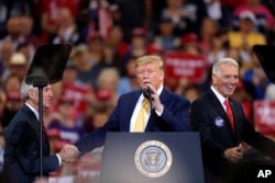 FILE - President Donald Trump speaks at campaign rally in Lake Charles, La., Oct. 11, 2019.