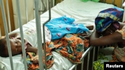  Une enfant victime du paludisme au Ghana