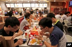 Customers eat at a McDonald's restaurant in Hong Kong on July 25, 2014.