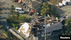 Collapsed houses caused by an earthquake are seen in Mashiki town, Kumamoto prefecture, southern Japan, April 15, 2016.