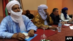Members of Ansar Dine and Tuareg National Movement for the Liberation of Azawad during a meeting in Algiers, Algeria, December 21, 2012.