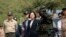 FILE - Taiwan's President Tsai Ing-wen, center, inspects at Su'ao naval station during a navy exercise in the northeastern port of Su'ao in Yilan County, Taiwan, Friday, April 13, 2018. Taiwan's government said Thursday that recent Chinese military drills aim to intimidate the island and are a threat to regional peace and stability.