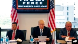 FILE - In this Aug. 17, 2016, photo, then-Republican presidential candidate Donald Trump participates in a roundtable discussion on national security in his offices in Trump Tower in New York.