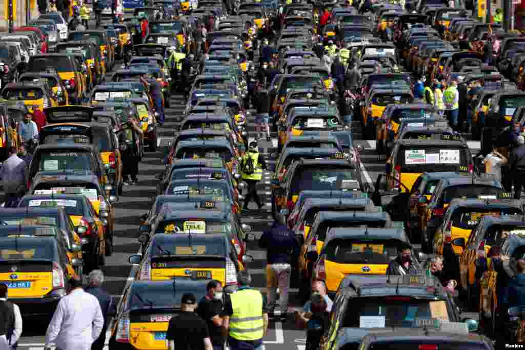 Taxi drivers protest against the regulation of VTC cars (Uber and Cabify) in Barcelona, Spain.