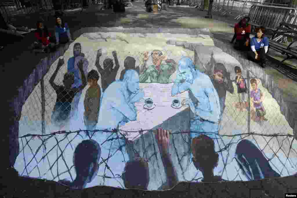 A 3D art piece showing Russian President Vladimir Putin and U.S. President Barack Obama sitting over a map of Syria by artist Eduardo Relero is displayed during the United Nations General Assembly in New York.