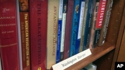 A row of books about President George Washington line a shelf at the New Hampshire Political Library at Saint Anselm College in Manchester, New Hampshire, June 9, 2017.