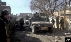 Iraqi security forces enter the southern neighborhoods of Ramadi, 115 kilometers (70 miles) west of Baghdad, Iraq, Dec. 23, 2015.