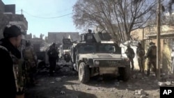 Iraqi security forces enter the southern neighborhoods of Ramadi, 70 miles (115 kilometers) west of Baghdad, Iraq, Dec. 23, 2015.