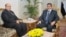 Egyptian President Mohamed Morsi (R) is seen with Prosecutor General Talaat Abdullah in a photo released by Morsi's office November 22, 2012.