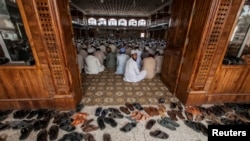Students attend a lesson at Darul Uloom Haqqania, an Islamic seminary and alma mater of several Taliban leaders, in Akora Khattak, Khyber Pakhtunkhwa province, Sept. 14, 2013. Thirty thousand madrassas operate across Pakistan; thousands are not registered with the government and are teaching grounds and recruiting points for militants, intelligence officials say.
