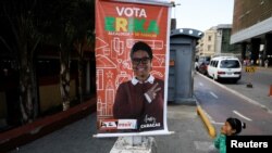 A campaign poster for Erika Farias, a pro-government candidate for mayor of Caracas' Libertador district, hangs in the Venezuelan capital. Venezuelans vote Sunday on 335 open mayoral seats.