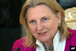 FILE - Austrian Foreign Minister Karin Kneissl speaks during a meeting in Moscow, Russia, April 20, 2018.