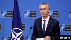 FILE - NATO Secretary General Jens Stoltenberg gives a press briefing at the Alliance headquarters in Brussels, Belgium, Jan. 14, 2021.