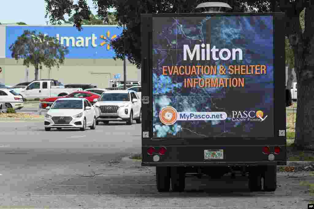 An LED signage truck with loudspeakers makes announcements informing residents of mandatory evacuations in preparation for Hurricane Milton, Oct. 8, 2024, in Port Richey, Florida.