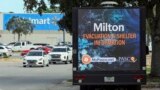 An LED signage truck with loudspeakers makes announcements informing residents of mandatory evacuations in preparation for Hurricane Milton, Oct. 8, 2024, in Port Richey, Fla.