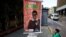 Campaign posters for Erika Farias, a pro-government candidate for mayor of Caracas' Libertador district, hang in the Venezuelan capital. 