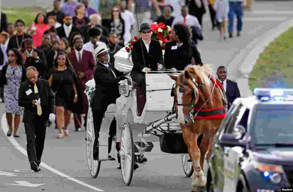 The funeral procession for Philando Castile approaches the Cathedral of St. Paul where services will take place in St. Paul, Minnesota. The 32-year-old school cafeteria supervisor was killed after a policeman pulled over his vehicle a week ago.