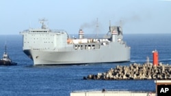 The MV Cape Ray is escorted by tug boats as it arrives at Gioia Tauro port, southern Italy. (FILE)