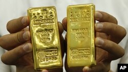 Gold bars are shown at the Korea Gold Exchange in Seoul, South Korea. Gold's allure stems in part from fears that the world's major economies are dangerously indebted, August 9, 2011