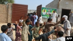 Villagers gather at the home of Olympic gold-medalist Arshad Nadeem in Mian Channu on Aug. 9, 2024, to celebrate his victory in the javelin throw at the Paris Olympics the day before. Nadeem ended Pakistan's decadeslong medal drought.