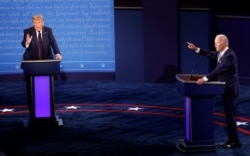 U.S. President Donald Trump and Democratic presidential nominee Joe Biden participate in their first 2020 presidential campaign debate held on the campus of the Cleveland Clinic at Case Western Reserve University in Cleveland, Ohio, U.S., September 29, 2020