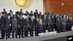 African heads of state, joined by Palestinian President Mahmoud Abbas, sixth from left in front row, and United Nations Secretary-General Ban ki-Moon, third from right in front row, pose for a group photograph at the annual African Union (AU) summit held at the AU headquarters in Addis Ababa, Ethiopia, Friday, Jan. 30, 2015. African leaders Friday appointed 90-year-old Zimbabwean President Robert Mugabe, who has ruled his country since 1980, as the new chairman of the 54-nation African Union, succeeding Mauritania's President Mohamed Ould Abdel Aziz. (AP Photo/Elias Asmare)
