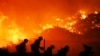 Firefighters battle the Saddleridge fire in Sylmar, Calif., Oct. 11, 2019.