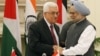 Indian Prime Minister Manmohan Singh, right, shakes hands with Palestinian President Mahmoud Abbas after the leaders signed agreements in New Delhi, India, Tuesday, Sept. 11, 2012.