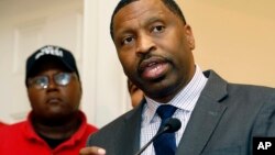 NAACP Interim president and CEO Derrick Johnson, right, speaks during a July 31, 2017 news conference in Jackson, Mississippi.