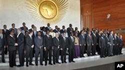 African heads of state, joined by Palestinian President Mahmoud Abbas, sixth from left in front row, and UN Secretary-General Ban ki-Moon, third from right in front row, pose for a group photograph at the annual African Union summit held at the AU headquarters in Addis Ababa, Ethiopia, Jan. 30, 2015. 